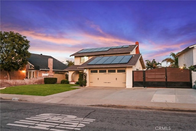 view of front of property with a lawn and solar panels