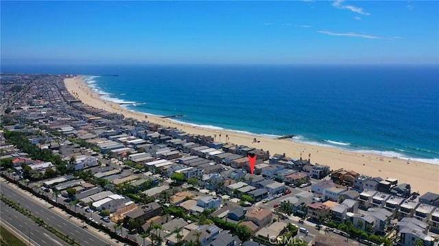 aerial view featuring a view of the beach and a water view