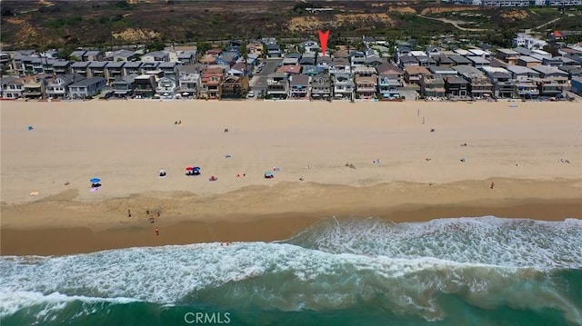 birds eye view of property with a water and mountain view