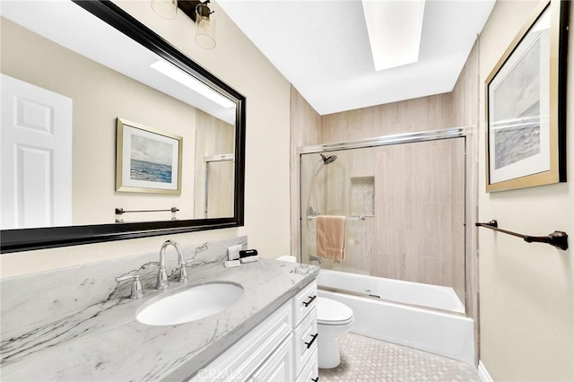 full bathroom featuring vanity, tile patterned flooring, shower / bath combination with glass door, and toilet