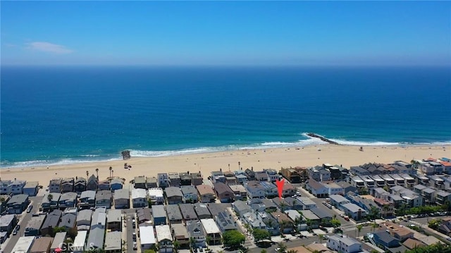 bird's eye view featuring a view of the beach and a water view