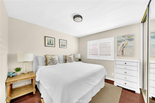 bedroom featuring dark hardwood / wood-style floors