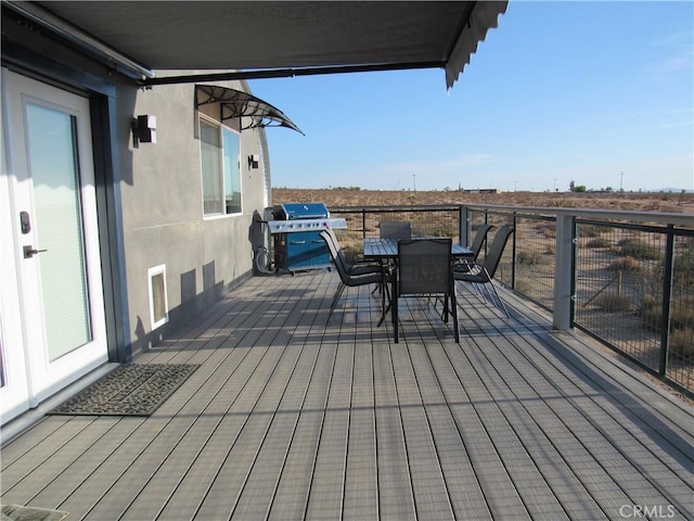 wooden deck with grilling area