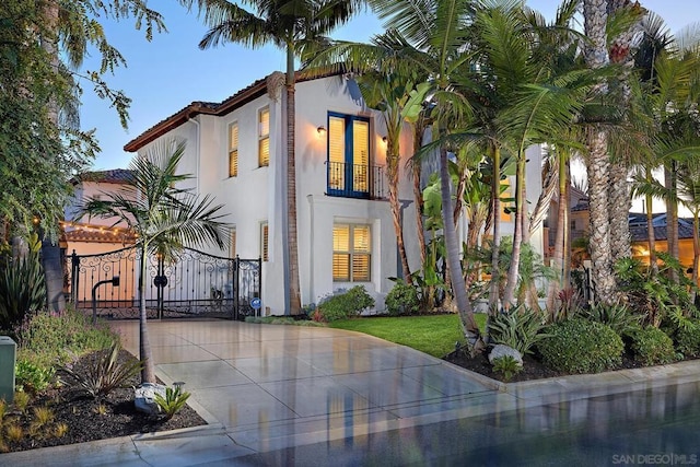 mediterranean / spanish house with a balcony