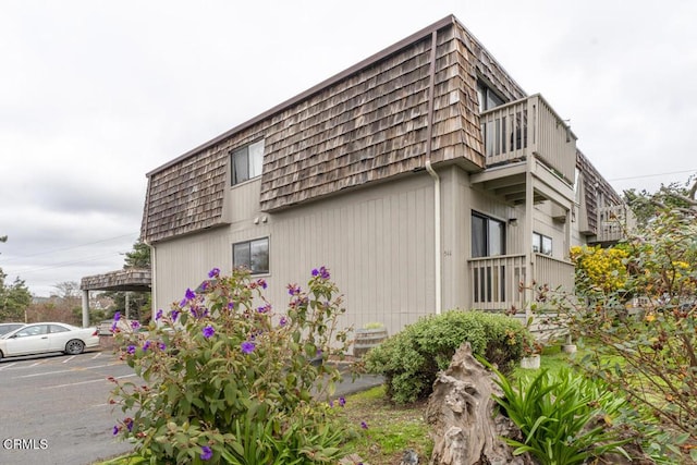 view of property exterior with a balcony