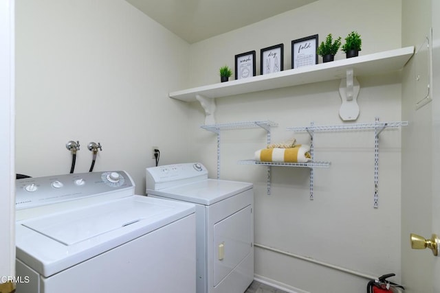 laundry room featuring washing machine and clothes dryer