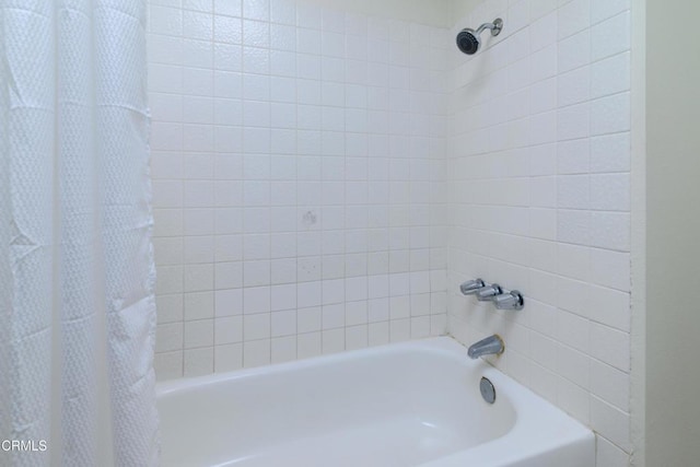 bathroom featuring shower / tub combo with curtain