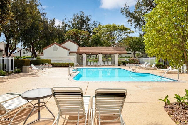 view of swimming pool with a patio