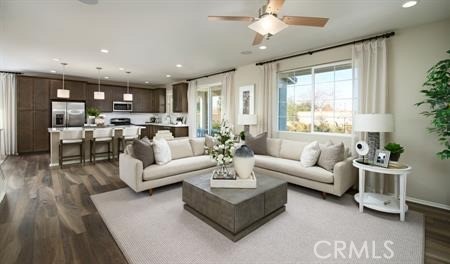 living room with hardwood / wood-style flooring and ceiling fan