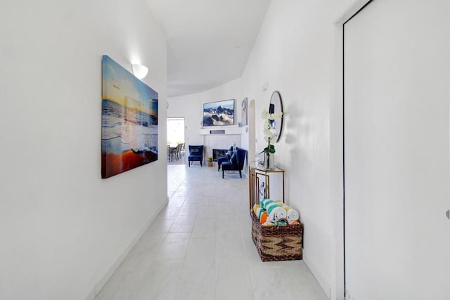 hall featuring light tile patterned floors