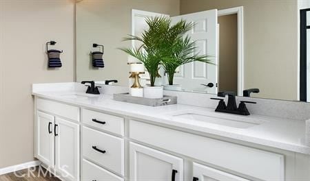 bathroom featuring vanity and wood-type flooring