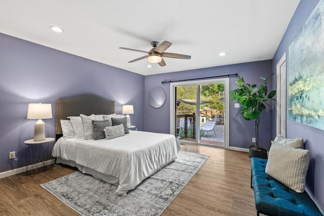 bedroom with access to exterior, hardwood / wood-style flooring, and ceiling fan