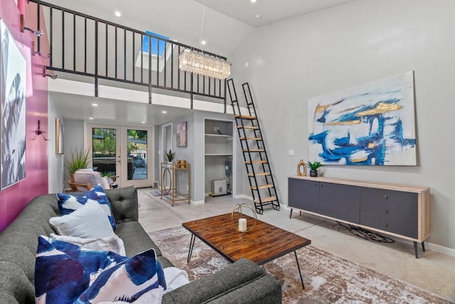 living room with french doors and a high ceiling