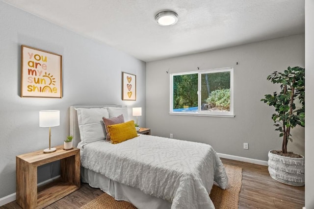 bedroom featuring hardwood / wood-style floors