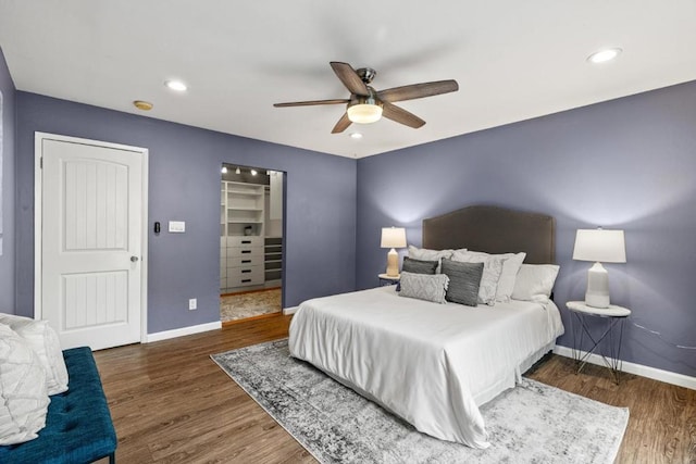 bedroom featuring ceiling fan and dark hardwood / wood-style floors