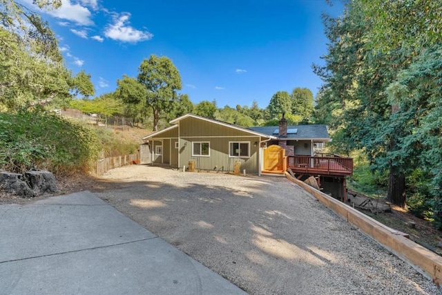 ranch-style house featuring a wooden deck