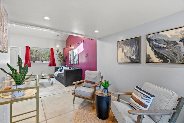 sitting room with lofted ceiling