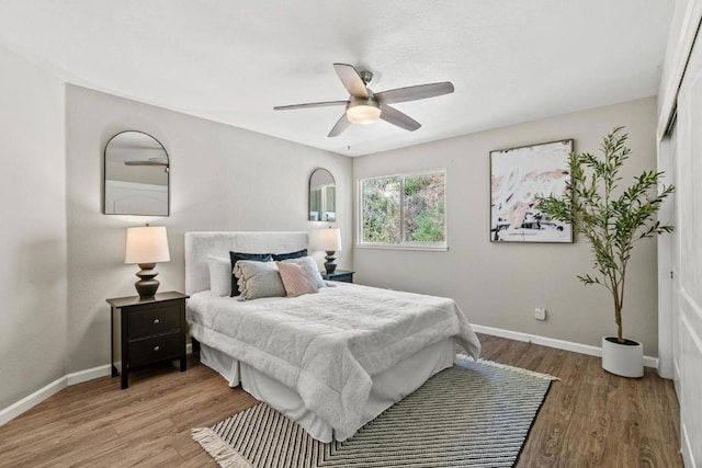 bedroom featuring hardwood / wood-style floors and ceiling fan