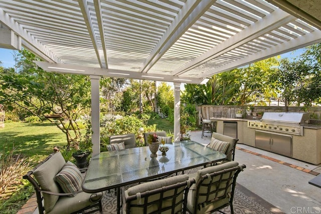 view of patio with a pergola, grilling area, and an outdoor kitchen