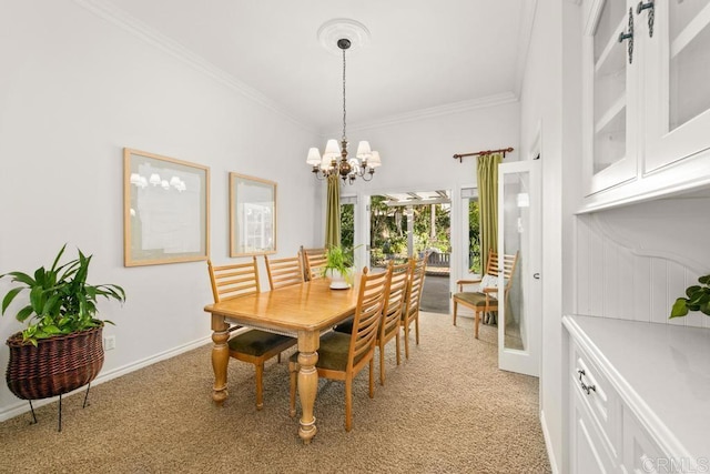 dining area with crown molding, light colored carpet, and a chandelier