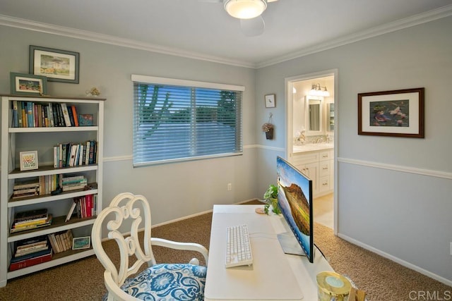 home office with crown molding and carpet