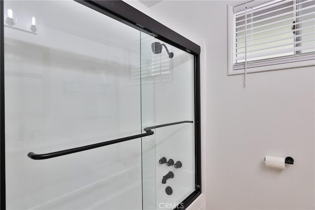 bathroom featuring enclosed tub / shower combo