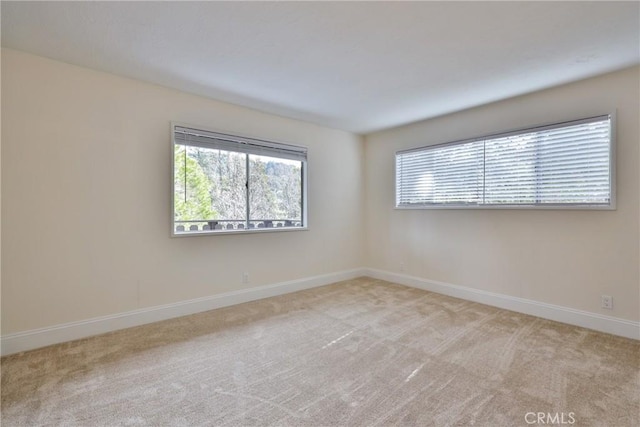 empty room with light colored carpet