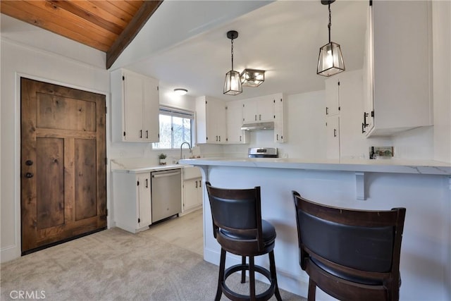 kitchen with white cabinetry, appliances with stainless steel finishes, pendant lighting, and kitchen peninsula