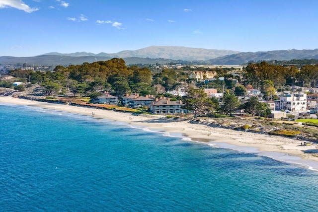 view of water feature featuring a mountain view and a beach view