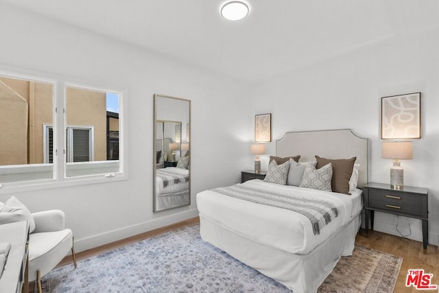 bedroom with light hardwood / wood-style floors