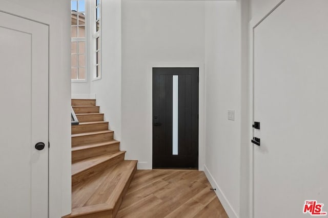 foyer entrance with light wood-type flooring