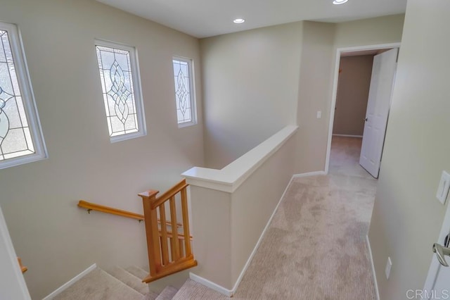 interior space featuring light colored carpet