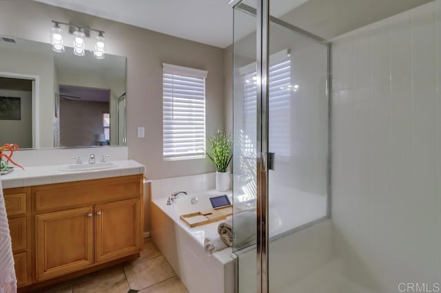 bathroom with vanity, tile patterned floors, and plus walk in shower