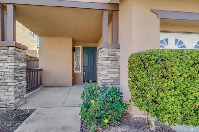 doorway to property featuring a garage