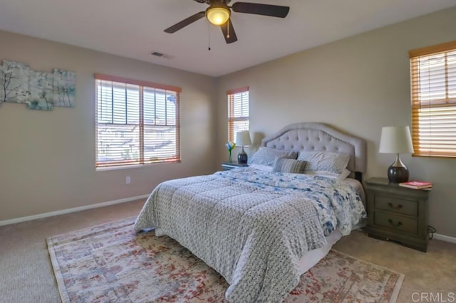 bedroom with ceiling fan and light colored carpet