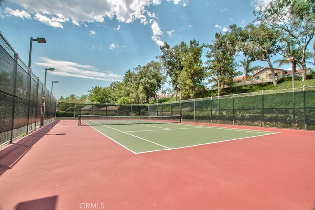 view of tennis court with basketball court