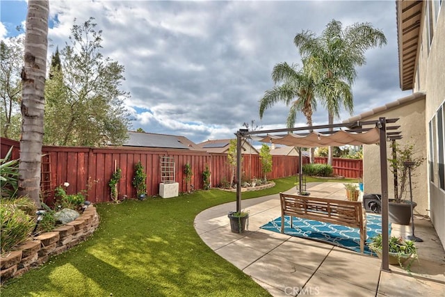 view of yard with a pergola and a patio area