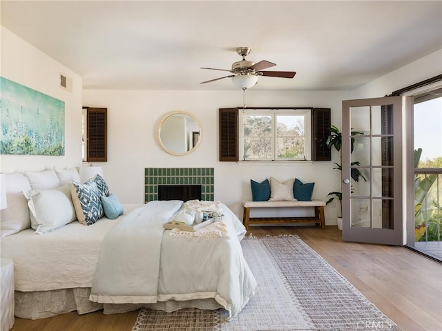 bedroom with hardwood / wood-style flooring and ceiling fan