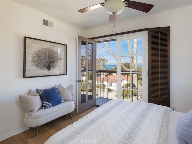 bedroom with hardwood / wood-style floors and ceiling fan