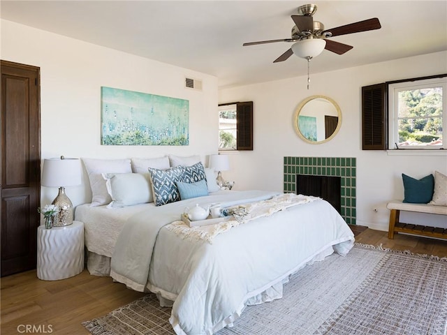 bedroom featuring wood-type flooring and ceiling fan