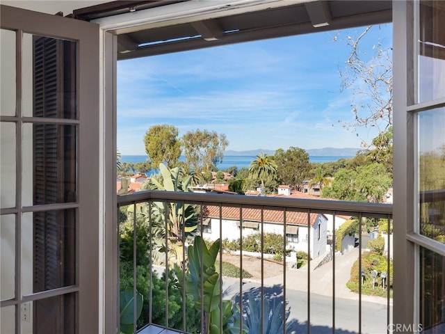 balcony featuring a water view