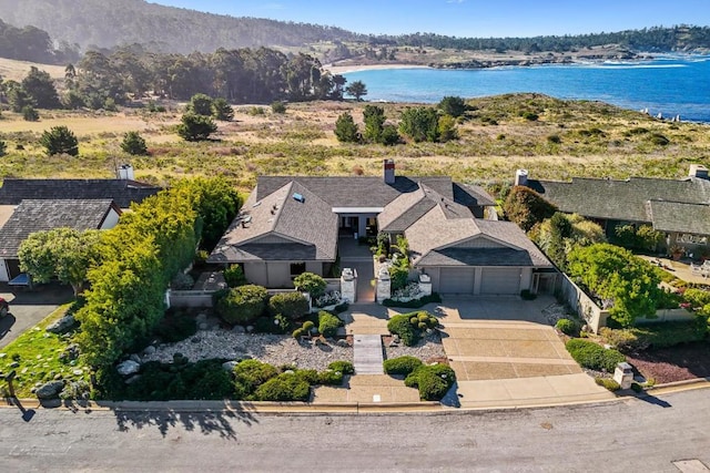 birds eye view of property featuring a water view