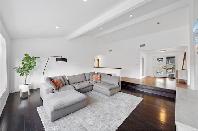 living room featuring lofted ceiling with beams and dark hardwood / wood-style floors