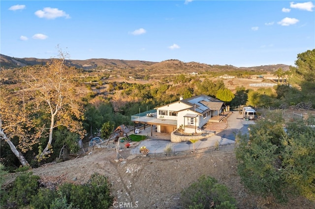 birds eye view of property with a mountain view