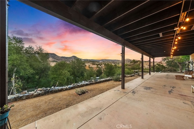 patio terrace at dusk with a mountain view