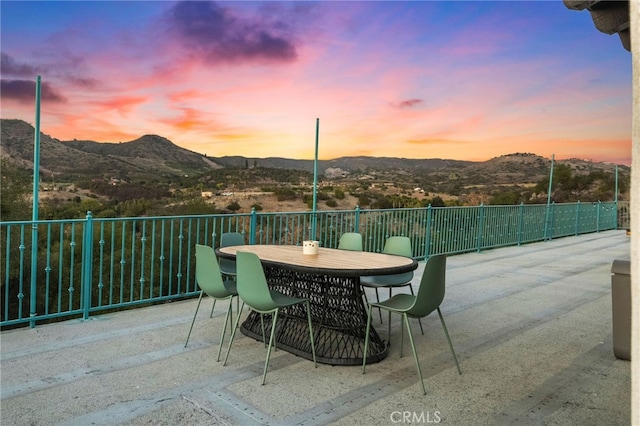 patio terrace at dusk with a mountain view