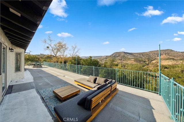 view of patio featuring outdoor lounge area and a mountain view