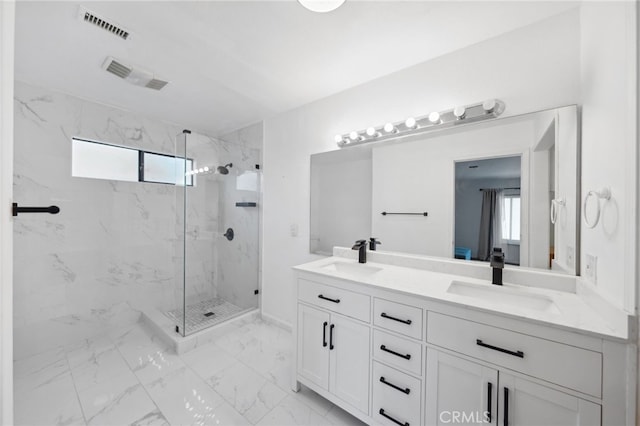 bathroom featuring vanity and walk in shower