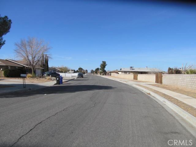 view of road featuring curbs and sidewalks