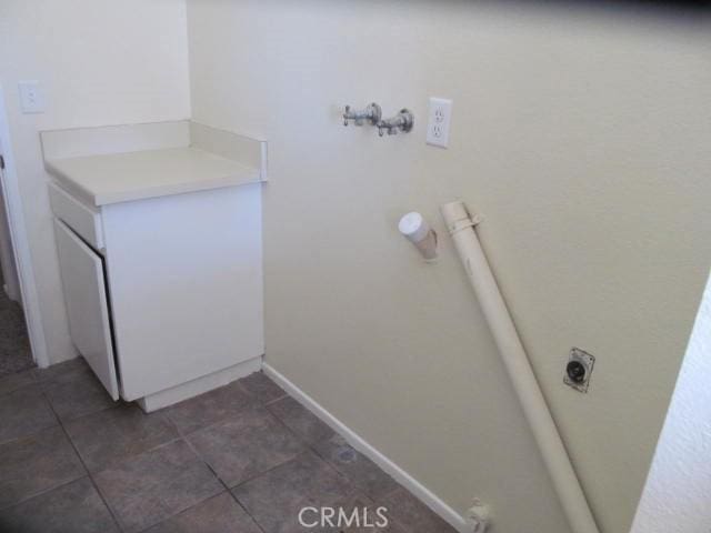 bathroom with tile patterned flooring and baseboards